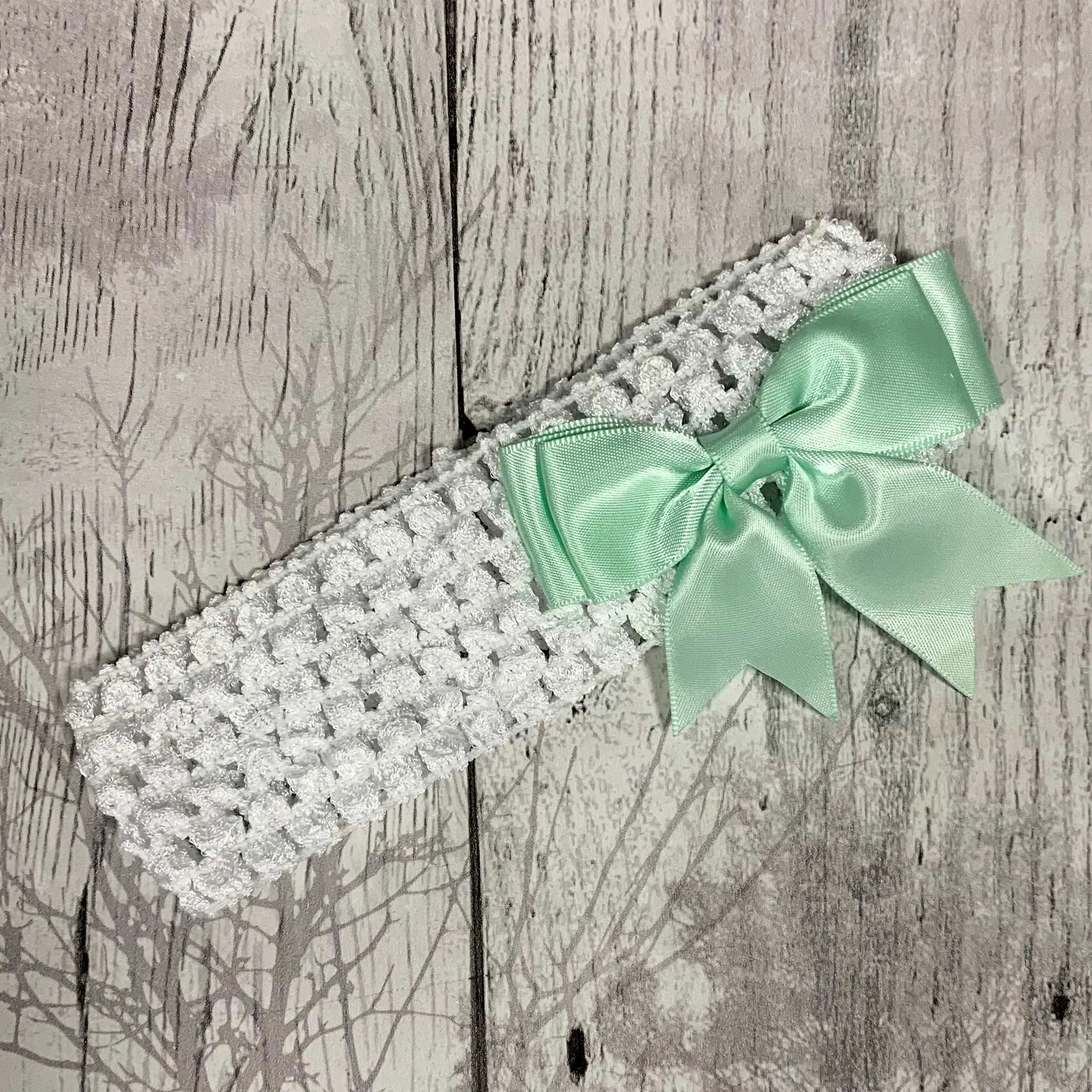 Baby girls crochet headband with mint green satin bow