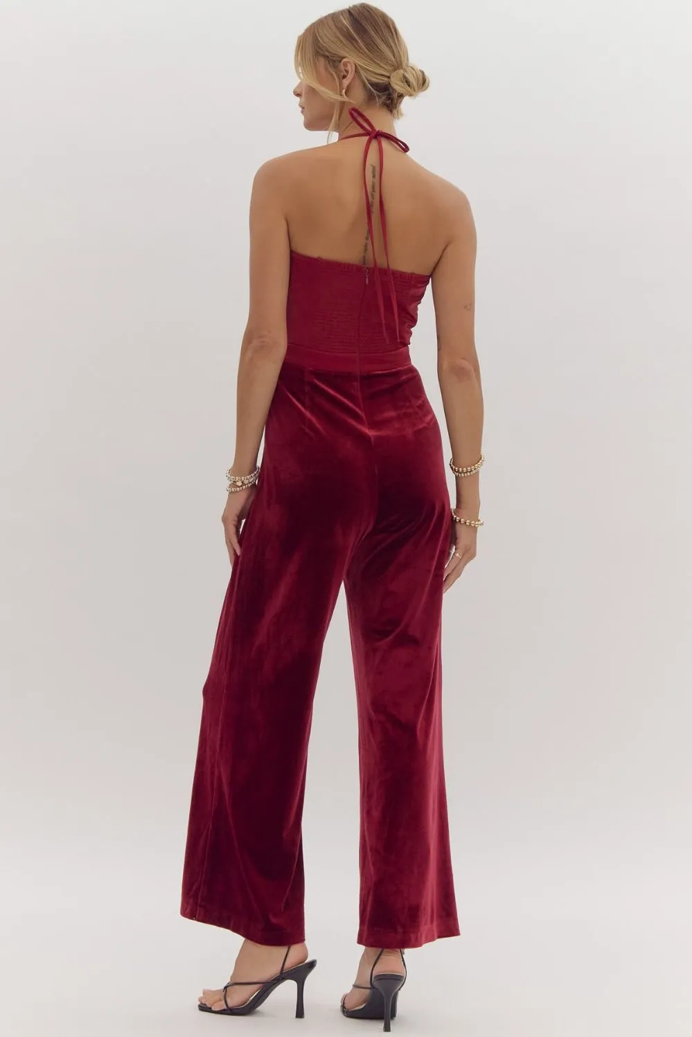 Velvet jumpsuit featuring oversized bow